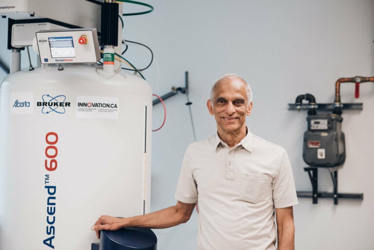 PAL Lab Spectrometer with Staff Member Smiling Beside