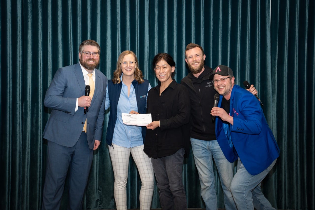 (From L-R) Andrew MacIsaac, CEO and Tessa Vriend, Director of Engagement & Brand at API, with Tim Lynn and Zack Storms, Co-founders of Startup TNT, presenting the $50,000 cheque to Toshifumi Yokota (centre), Co-founder of OligomicsTx and winner of the 2024 Life Sciences Investment Summit.